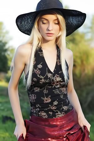 Skinny blonde Kira shows her small boobs and tight ass outdoor
