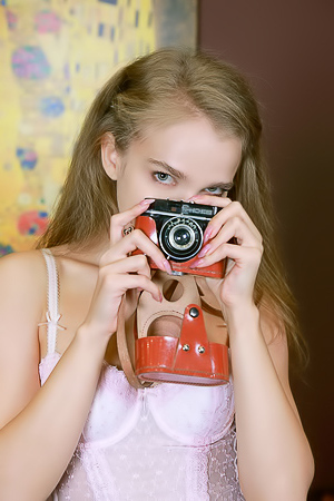 Xenia Glancing Back Over Her Shoulder With A Flirtatious Smile