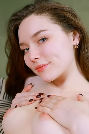 Carley Going Face Down On The Covers For An Enticing Rear View