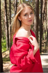 Karianne Strips Besides A Log In The Forest Revealing Perky Nipples