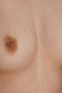 Neesa Smiles Flirtatiously As Her Beautiful Breasts Bounce Free