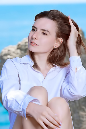 Nika Smiling With Pleasure As The Stimulating Ocean Breeze Caresses Her Sexy Body