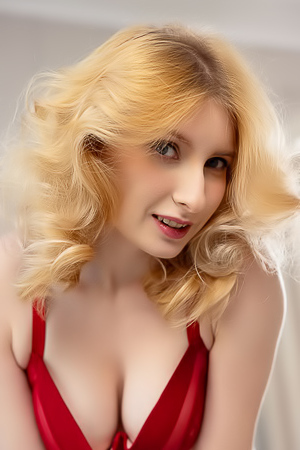 Minnie Lighter Teases On The Couch With Seductive Lingerie And Alluring Curves