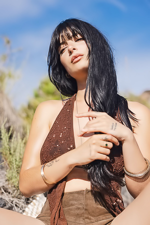 Sary Catalina: a frame of bold tattoos, natures hairdresser, shorts defying gravity