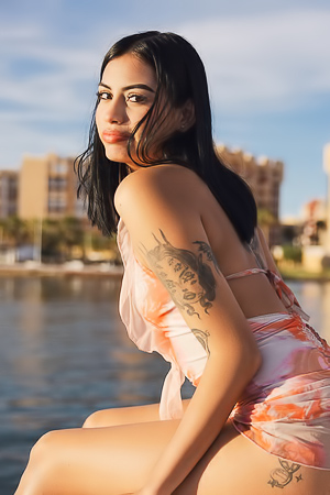 Tension Grows as Sofia Poses in Swimsuit on Marina Blue Floor