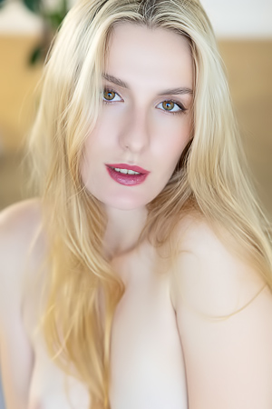 Lillies Topless Tease in a bedroom of linens